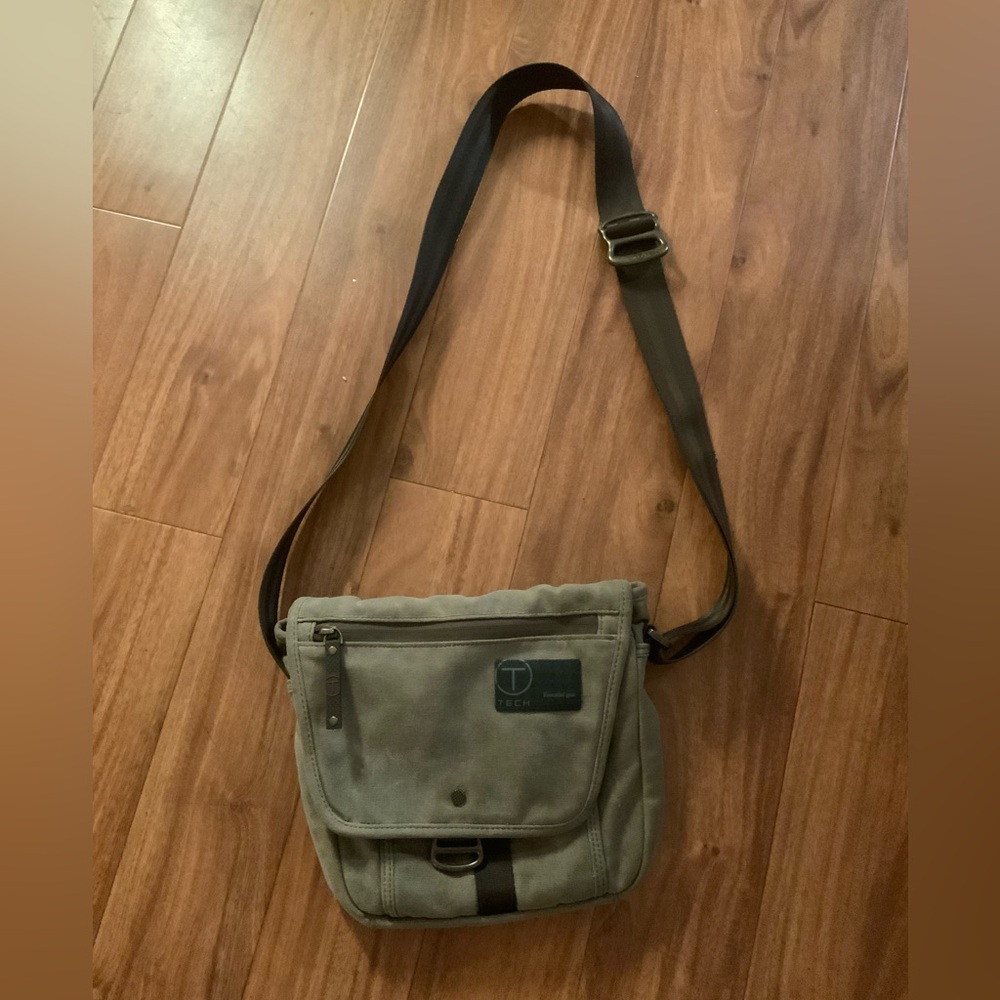 Tumi Tech Crossbody Bag. Solid khaki material. Minor stain pictured. Unisex styl